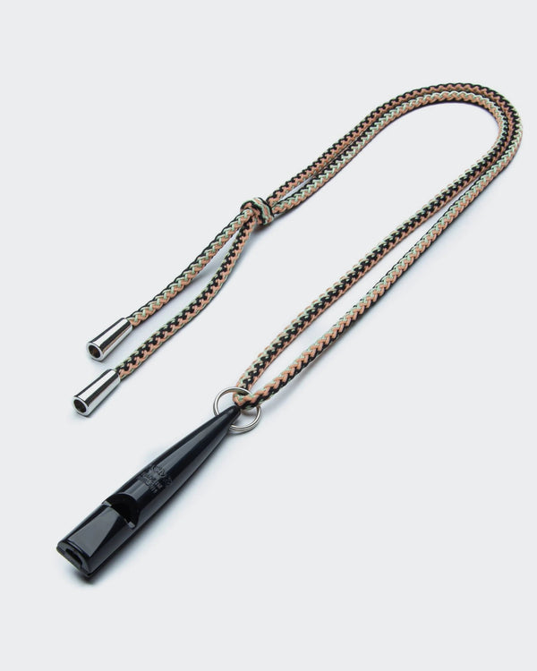 Black whistle with braided lanyard on a light gray background